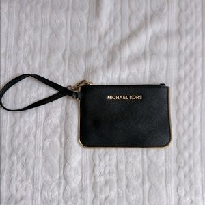 Michael Kors Black leather wristlet with gold trim